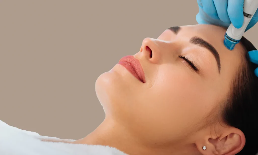 HydraFacial handpiece performing painless vacuum extraction during a medical facial at Dr Azra Clinic, Dubai